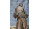 Outdoor bronze diver statue with nautical decor and cloudy sky background at 1020 Bowsprit Ln # X, Holiday, FL 34691