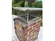 Close-up of a brick chimney with a metal chimney cap at 1044 Virginia Dr, Sarasota, FL 34234