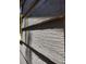 Up close exterior shot of the textured, gray wood siding at 1044 Virginia Dr, Sarasota, FL 34234