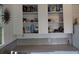 Practical kitchen with open shelving displaying dishes and pantry items for convenient access at 1044 Virginia Dr, Sarasota, FL 34234