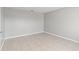 Empty bedroom showcasing tile floor, neutral wall color, and ample natural light at 11041 Claymore St, Spring Hill, FL 34608