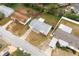 Aerial view of the property with a well-maintained yard and surrounding neighborhood streets at 1109 Landau St, Holiday, FL 34690