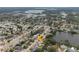 Aerial view of the property in a lakeside neighborhood showing a backyard at 1109 Landau St, Holiday, FL 34690
