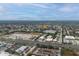 Aerial view highlighting the neighborhood, showcasing the home's proximity to commercial areas and roadways at 1109 Landau St, Holiday, FL 34690