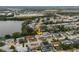 Aerial view of the neighborhood, highlighting the home's location near a lake at 1109 Landau St, Holiday, FL 34690