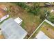 Aerial view of the backyard showing the fence line and a shed on the property at 1109 Landau St, Holiday, FL 34690