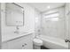 Well-maintained bathroom with new vanity, sleek fixtures, and tub with tile surround at 1109 Landau St, Holiday, FL 34690
