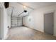 Spacious garage with white walls, concrete floors, and garage door at 1109 Landau St, Holiday, FL 34690