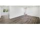 Spacious and bright living room with light wood floors and a sliding glass door at 1109 Landau St, Holiday, FL 34690