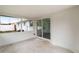 Covered patio with concrete floors and view of fenced yard at 1109 Landau St, Holiday, FL 34690