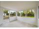 Enclosed sunroom with screening and view of yard at 1109 Landau St, Holiday, FL 34690