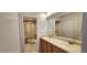 Dual-sink bathroom with separate shower and tub rooms, showcasing modern fixtures at 11722 Currie Ln # E1, Largo, FL 33774