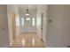 Bright entryway with neutral tile flooring and a traditional front door featuring a half-round window at 11722 Currie Ln # E1, Largo, FL 33774