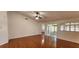 Large living room with hardwood flooring and natural light at 11722 Currie Ln # E1, Largo, FL 33774