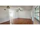 Bright living room with vaulted ceilings, hardwood floors, and an open floor plan at 11722 Currie Ln # E1, Largo, FL 33774