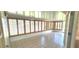 Covered patio with tiled floor and wooden shutters at 11722 Currie Ln # E1, Largo, FL 33774