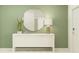 Stylish hallway with modern console table, decorative mirror, and accent lighting at 13035 Ruby Gold Ct, Wimauma, FL 33598