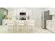 Modern kitchen with a breakfast bar and stainless steel appliances at 13035 Ruby Gold Ct, Wimauma, FL 33598