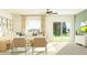Cozy living room with patio access, ceiling fan, and stylish furnishings at 13035 Ruby Gold Ct, Wimauma, FL 33598
