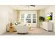 Inviting living room showcasing a large window and comfortable seating area at 13035 Ruby Gold Ct, Wimauma, FL 33598