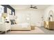 Inviting main bedroom featuring a comfortable bed, soft rug, and bright natural light at 13035 Ruby Gold Ct, Wimauma, FL 33598