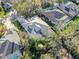 High angle capture of a home featuring screened pool, landscaped backyard, and neighborhood setting at 15918 Sorawater Dr, Lithia, FL 33547