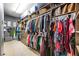 Organized walk-in closet featuring multiple storage solutions for clothes, handbags, and accessories at 15918 Sorawater Dr, Lithia, FL 33547