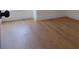 Bedroom showcasing wood-look flooring and light colored baseboards and trim at 16147 Sagebrush Rd, Tampa, FL 33618