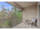 Comfortable screened-in balcony with peaceful views of the surrounding foliage, perfect for outdoor relaxation at 17106 Carrington Park Dr # 622, Tampa, FL 33647