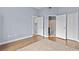 Spacious bedroom with wood floors, walk-in closet, and ensuite bathroom for convenience at 17106 Carrington Park Dr # 622, Tampa, FL 33647