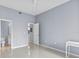 Bedroom featuring ceramic flooring with ensuite bathroom and closet access at 17106 Carrington Park Dr # 622, Tampa, FL 33647
