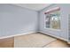 Inviting bedroom featuring neutral walls, wood floors and a large arched window offering natural light at 17106 Carrington Park Dr # 622, Tampa, FL 33647