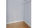 Empty closet with wooden floor and closet rods at 17106 Carrington Park Dr # 622, Tampa, FL 33647