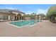 Community pool surrounded by lounge chairs at 17106 Carrington Park Dr # 622, Tampa, FL 33647
