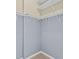 Walk-in closet with ample shelving and rods for storage and organization of clothes and accessories at 17106 Carrington Park Dr # 622, Tampa, FL 33647