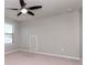 Carpeted bedroom with ceiling fan and window with blinds at 2208 Landside Dr, Valrico, FL 33594
