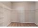 Walk-in closet featuring wire shelving and neutral carpet at 2208 Landside Dr, Valrico, FL 33594