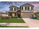 Charming two-story home with a well-manicured lawn and attached two car garage in a suburban neighborhood at 2208 Landside Dr, Valrico, FL 33594