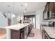 Well-equipped kitchen featuring a large island, stainless steel appliances, and stylish pendant lighting at 2208 Landside Dr, Valrico, FL 33594