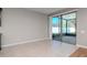 Bright living area with tile floors and sliding glass doors to outdoor space at 2208 Landside Dr, Valrico, FL 33594