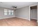 Spacious living room with wood floors, ceiling fan, and large window at 2208 Landside Dr, Valrico, FL 33594