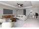 Bright living room offers modern decor, a ceiling fan, and ample natural light at 2208 Landside Dr, Valrico, FL 33594