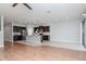 Bright open living area with wood floors flowing into the kitchen, showcasing a versatile living space at 2208 Landside Dr, Valrico, FL 33594