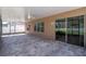 Large screened-in patio with brick flooring, ceiling fans, and slider access to the home at 2208 Landside Dr, Valrico, FL 33594