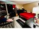 Bedroom with tile floor, dark furniture including dressers, and a red bedspread at 2213 65Th N Ave # 2213, St Petersburg, FL 33702