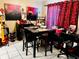 Dining area features a tile floor, marble table, and decor including artwork at 2213 65Th N Ave # 2213, St Petersburg, FL 33702