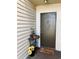 Charming front door with flowers, decor, and a stylish welcome mat offering a warm and inviting entrance at 2213 65Th N Ave # 2213, St Petersburg, FL 33702