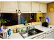 Kitchen features white cabinets, stainless steel sink, and an open counter view at 2213 65Th N Ave # 2213, St Petersburg, FL 33702