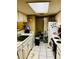 Functional kitchen with white appliances and cabinets, offering a practical and well-lit cooking area at 2213 65Th N Ave # 2213, St Petersburg, FL 33702