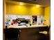 Bright kitchen bar area with bar stool seating, a pass-through to the kitchen, and ample counter space at 2213 65Th N Ave # 2213, St Petersburg, FL 33702